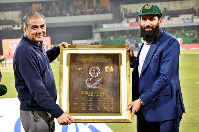 Pakistan Cricket Board (PCB) Chairman Mohsin Naqvi presents the PCB Hall of Fame plaque to former cricket player Misbah-ul-Haq during first match of Tri-Nation Series played between Pakistan and New Zealand cricket teams at Gaddafi Stadium