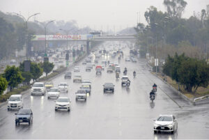 Commuters on their way during light rain that experienced in the twin cities
