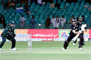 New Zealand's Devon Conway watches the ball after playing a shot during the final one-day international (ODI) cricket match of Tri-Nation series between Pakistan and New Zealand at the National Stadium