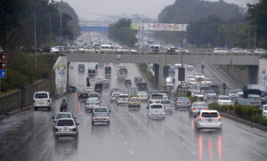 Commuters on their way during light rain that experienced in the twin cities