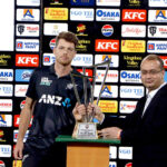 New Zealand's captain Mitchell Santner receives Winning trophy of the Tri-Nation series beating Pakistan in final match at the National Stadium