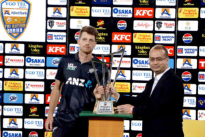 New Zealand's captain Mitchell Santner receives Winning trophy of the Tri-Nation series beating Pakistan in final match at the National Stadium