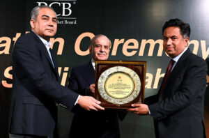 Prime Minister Muhammad Shehbaz Sharif presenting a shield award to Farhat Abbas Fakhir, Project Director, Infrastructure Department PCB in recognition of outstanding contribution and service for upgradation of Qaddafi Stadium