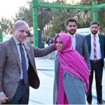 Prime Minister Muhammad Shehbaz Sharif praising career success of a graduate of Daanish School at a ceremony to mark Youm-e-Tameer-o-Taraqqi