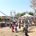 Students are enjoying swings in a funfair held at Islamabad Model College for Girls Bharakahu