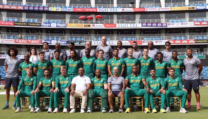 The South Africa cricket team poses for a group photo with officials ahead of their match against Pakistan in the Tri-Nation Series' third One-Day International (ODI) at the National Bank Stadium