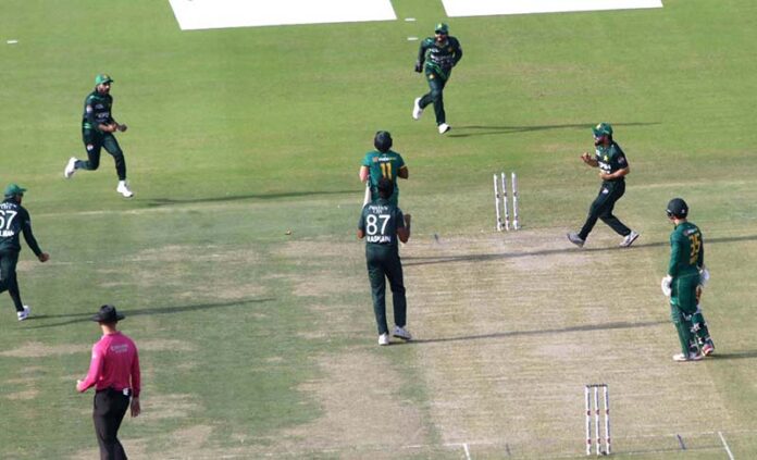 Pakistan's players celebrate after the dismissal of South Africa's captain Temba Bavuma during the ODI cricket match of Tri-Nation series between Pakistan and South Africa at the National Stadium