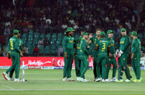 South Africa's Wiaan Mulder celebrates with teammates after taking the wicket of Pakistan's Babar Azam during the ODI cricket match of Tri-Nation series between Pakistan and South Africa at the National Stadium