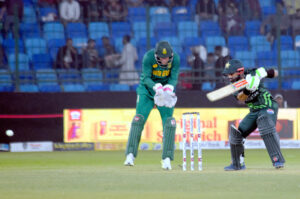 South Africa's Wiaan Mulder celebrates with teammates after taking the wicket of Pakistan's Babar Azam during the ODI cricket match of Tri-Nation series between Pakistan and South Africa at the National Stadium