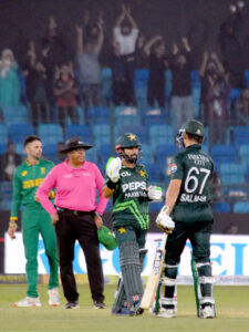South Africa's Wiaan Mulder celebrates with teammates after taking the wicket of Pakistan's Babar Azam during the ODI cricket match of Tri-Nation series between Pakistan and South Africa at the National Stadium