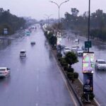 Vehicles pass through the Expressway amid rain in the Federal Capital