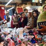 Women busy shopping on Chaand Raat in preparation for Eid ul Fitr at local market