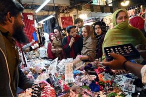 Women busy shopping on Chaand Raat in preparation for Eid ul Fitr at local market