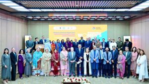 Prime Minister Muhammad Shehbaz Sharif in a group photo at the International Women's Day ceremony.
