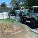 CDA worker busy watering plants on green belt at G-7 Area in the Federal Capital
