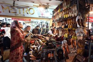 Women busy shopping on Chaand Raat in preparation for Eid ul Fitr at local market