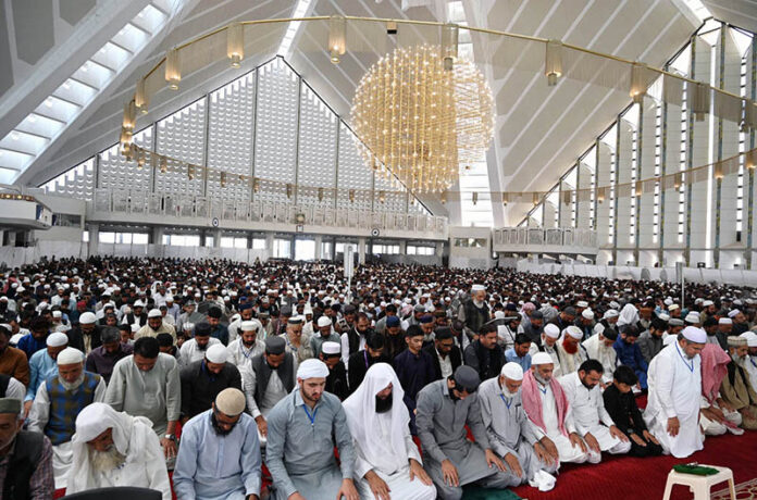 A large number of faithful offering Namaz-e-Juma-tul-Wida (Friday prayer) at Faisal Masjid during holy month of Ramzan