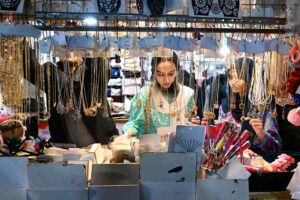 Women busy shopping on Chaand Raat in preparation for Eid ul Fitr at local market