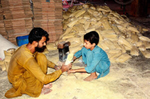 Workers are busy packing vermicelli (seviyan) after preparing it, as demand surges ahead of Eid-ul-Fitr