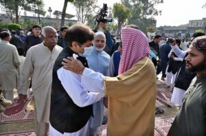 Federal Minister for Railways Hanif Abbasi exchanging Eid greetings with people after offering Eidul-Fitr prayers at Al- Aqsa Park, Satellite Town