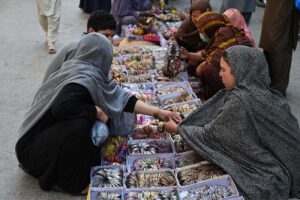 Women busy shopping on Chaand Raat in preparation for Eid ul Fitr at local market