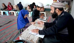 Children learning to recite Noorani Qaida from Qari at Jamia Masjid Al-Noor during the holy fasting month of Ramadan at G-7 in the Federal Capital