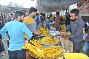 People buy potato chips from a stall to break their fast during the month of Ramadan.