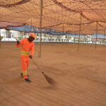 A worker is busy cleaning the Eidgah in preparation for Eid-ul-Fitr prayer