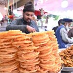 A vendor display and sells traditional food items during holy fasting month of Ramadan at Aabpara in the Federal Capital