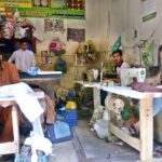 Tailors work tirelessly, stitching clothes to meet the high demand ahead of the upcoming Eid ul Fitr festival