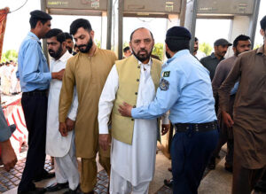 Police officials conduct security checks of faithful before Namaz-e-Juma-tul-Wida at Faisal Masjid during the holy month of Ramzan