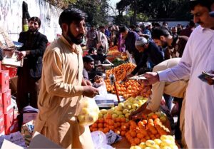A large number of people purchasing vegetables at Sasta Ramadan bazaar Aabpara in the Federal Capital