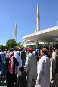Police officials conduct security checks of faithful before Namaz-e-Juma-tul-Wida at Faisal Masjid during the holy month of Ramzan