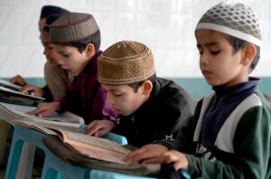 Children learning to recite Noorani Qaida from Qari at Jamia Masjid Al-Noor during the holy fasting month of Ramadan at G-7 in the Federal Capital