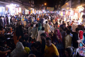 Women busy shopping on Chaand Raat in preparation for Eid ul Fitr at local market