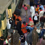 People boarding on train at Railway Station to leave for their hometowns to celebrate Eid-ul-Fitr with their loved ones