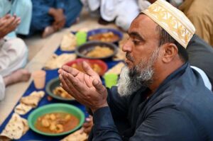 People offering Dua before breaking fast (Iftar) during Holy Month of Ramzan at Jamia Muhammadi Masjid.