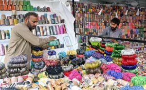 Vendors are busy arranging and displaying bangles to attract the customers at Jinnah Super Market in the Federal Capital in connection with upcoming Eidul Fitr