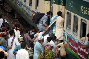 People boarding on train at Railway Station to leave for their hometowns to celebrate Eid-ul-Fitr with their loved ones