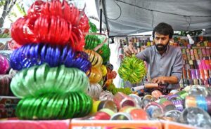 Vendors are busy arranging and displaying bangles to attract the customers at Jinnah Super Market in the Federal Capital in connection with upcoming Eidul Fitr