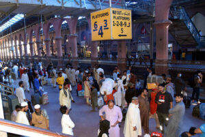 People boarding on train at Railway Station to leave for their hometowns to celebrate Eid-ul-Fitr with their loved ones