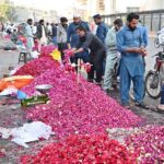 Vendors displaying flowers to attract the customers at roadside setup in Provincial Capital on the occasion of Eidul Fitr