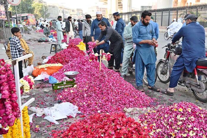 Vendors displaying flowers to attract the customers at roadside setup in Provincial Capital on the occasion of Eidul Fitr