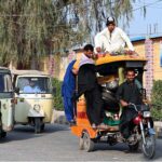 A person traveling on the rooftop of overloaded tricycle rickshaw at DIG Office Road may cause any fatal mishap and needs attention of concerned authorities