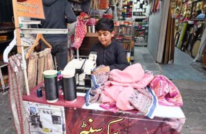 Workers dying clothes as per customers demand ahead of Eid-ul-Fitr at Aabpara Market