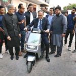 Federal Minister for Planning Development & Special Initiatives Prof. Ahsan Iqbal take a ride of Scooty motorcycle jointly develop by China and Pakistan after inaugurating the Pacific Green Energy, Pakistan’s newest electric vehicle company at Sundar Industrial Estate