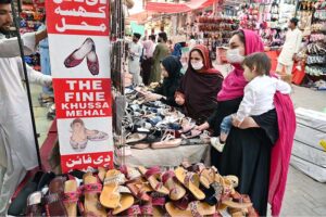 Workers dying clothes as per customers demand ahead of Eid-ul-Fitr at Aabpara Market