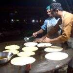 Vendors preparing traditional food stuff (Parathas) for Sehri at a local market during Holy Fasting Month of Ramzanul Mubarak