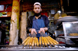 Vendor selling traditional sweet food item Kheer and Murabba at Fawara Chowk during the Islamic fasting month of Ramazan ul Mubarak