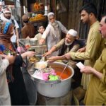 During the holy fasting month of Ramzan ul Mubarak, a vendor is selling traditional food items called 'Siri Paye' in the city